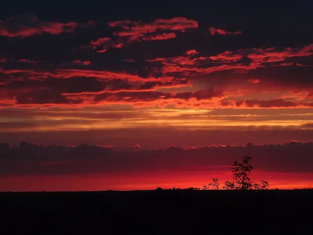 Prairie sunset with red clouds